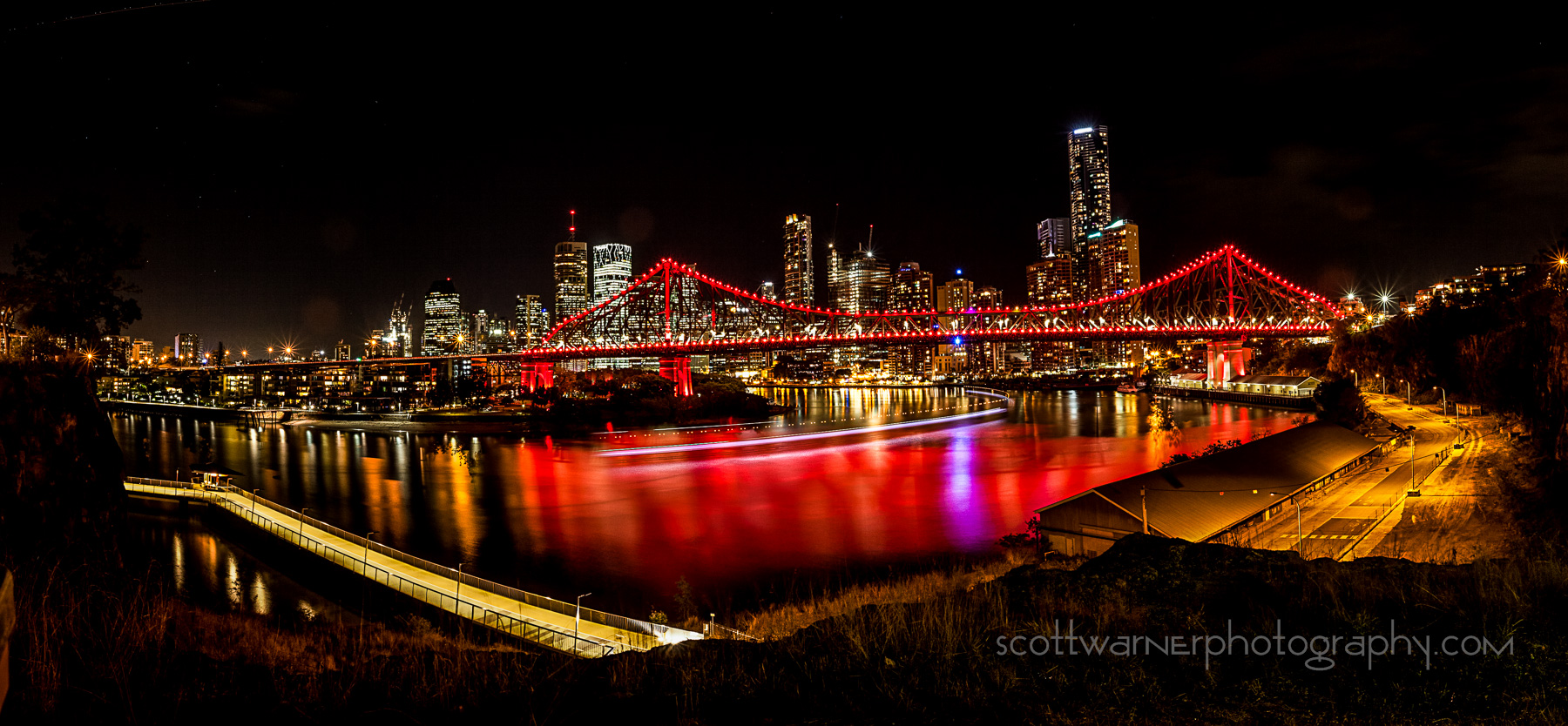 a 4 image panorama of Brisbane City from the New Farm area. I waited until the Citycat Ferry came past to get the curve of light in the river
